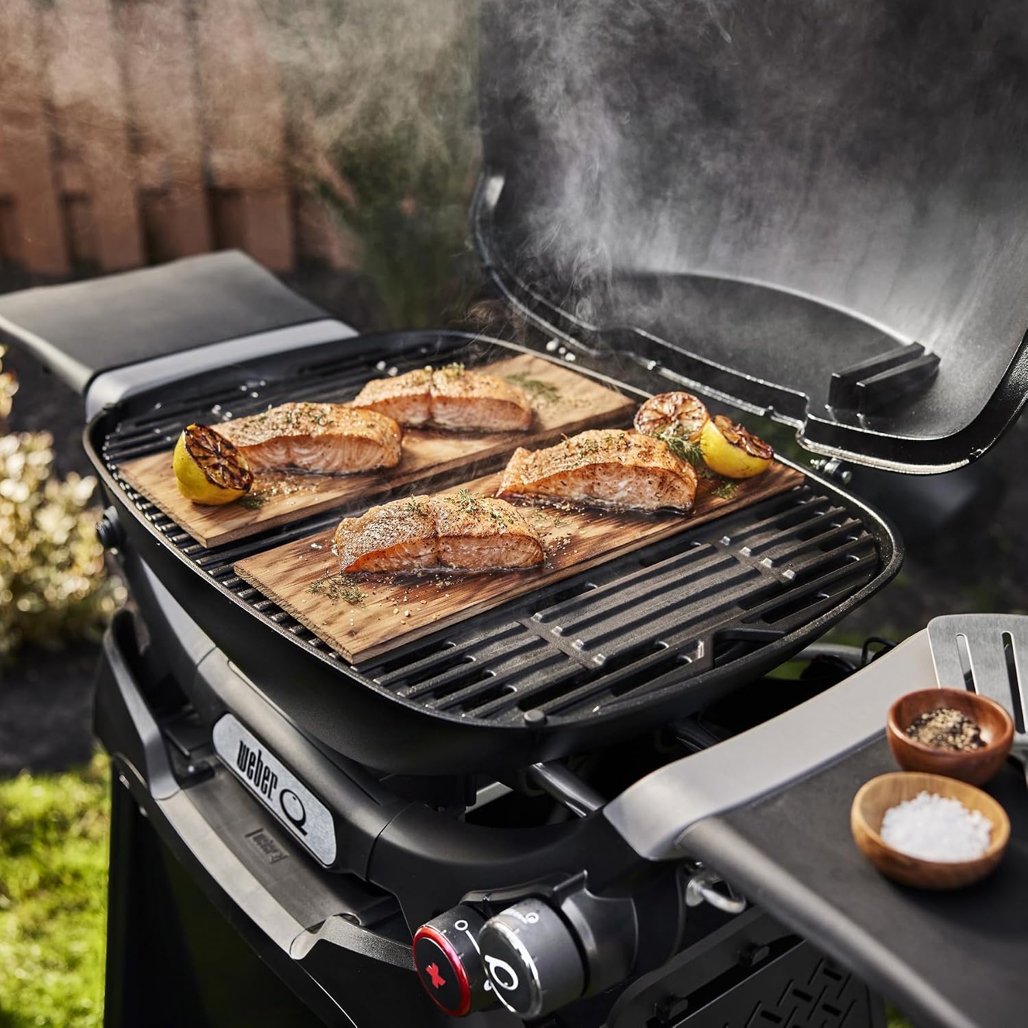 image:imageWeber Q 2800N Liquid Propane Grill with Stand Flame Red Wide 250700F Temp Range with Plus Burner for Searing LowTemp Roasting amp HighDome LidFlame Red